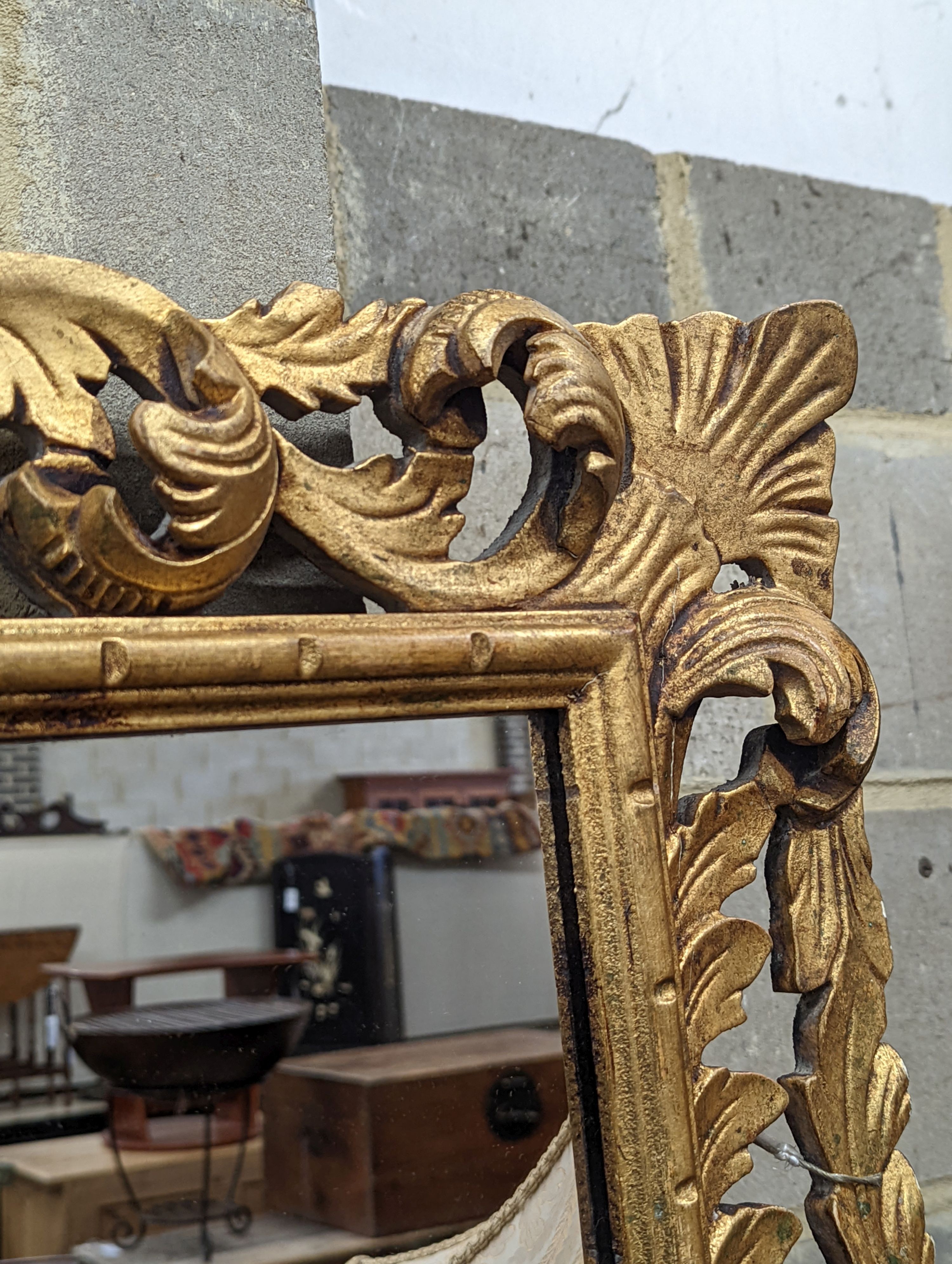 A Florentine style carved giltwood wall mirror, width 80cm, height 70cm
